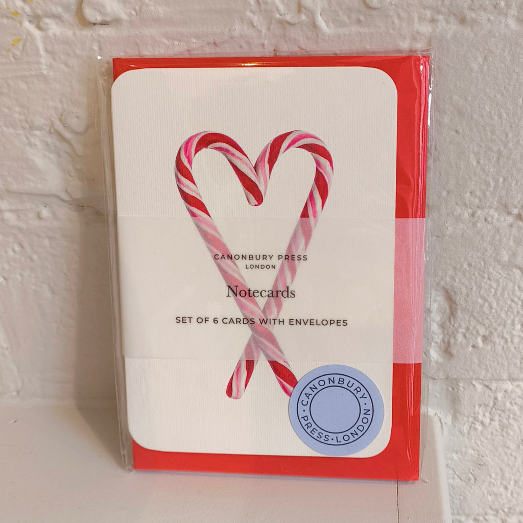 Pack of notecards with candy cane design on a white background