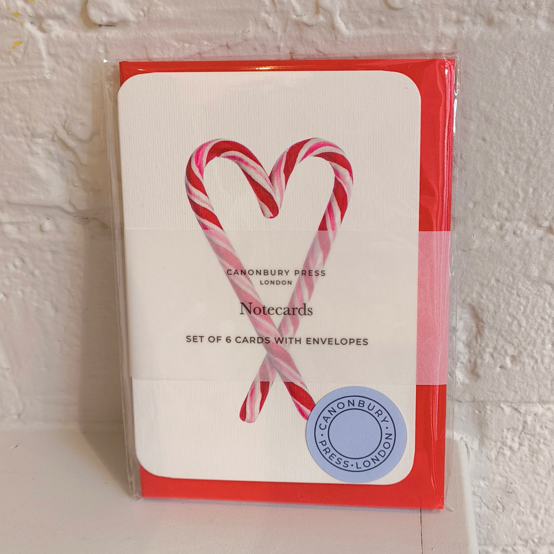 Pack of notecards with candy cane design on a white background