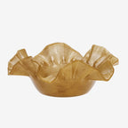 Gold ceramic bowl with ruffled edges on a white background