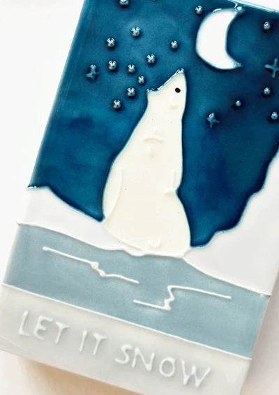 Close up of the glazed festive bear on the Let it Snow ceramic match box