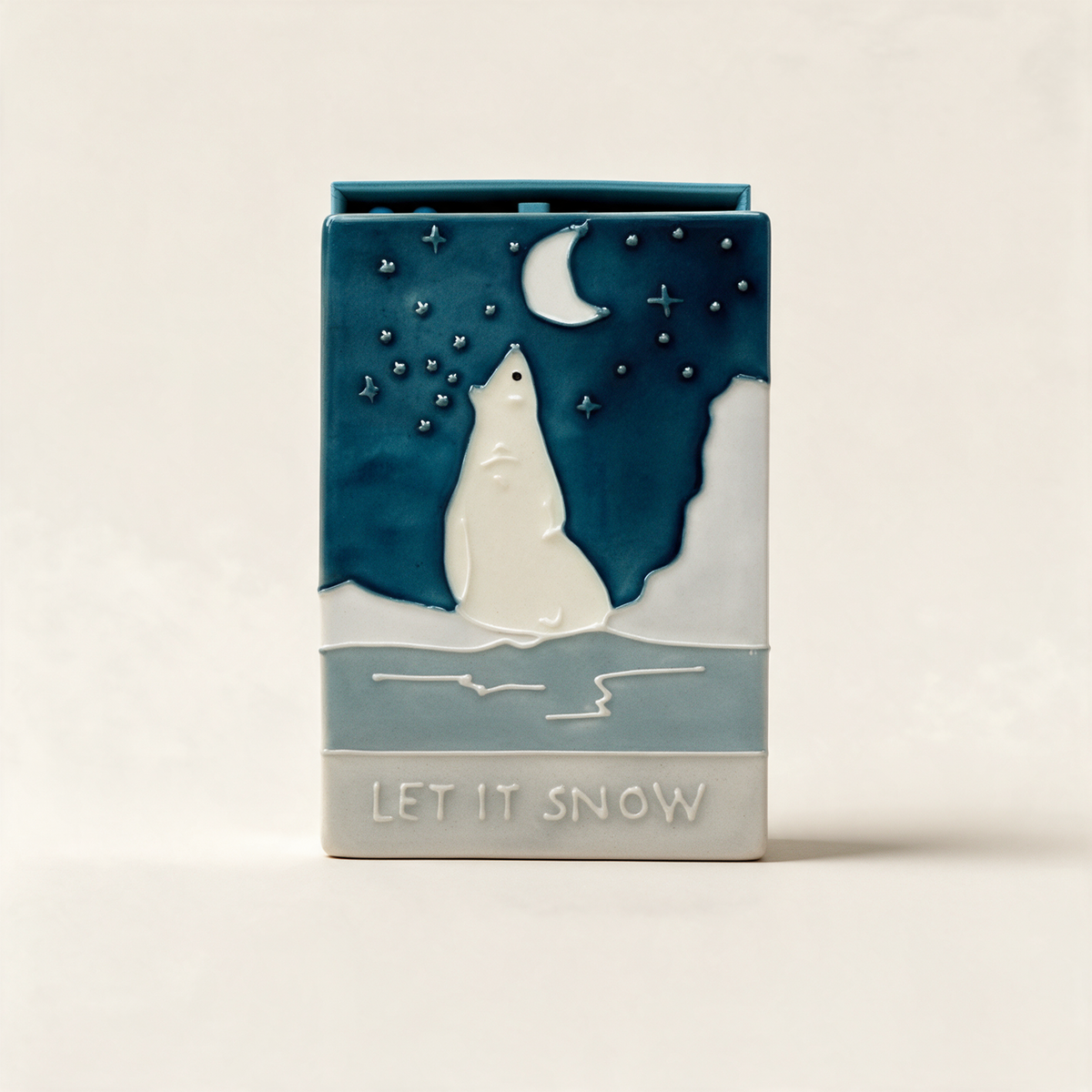 Let it Snow ceramic match box by Jo Laing with a festive bear on the lid, on a warm cream background