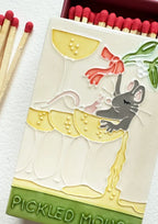 Close up of the glazed Pickled Mouse on the ceramic match box lid