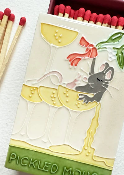 Close up of the glazed Pickled Mouse on the ceramic match box lid