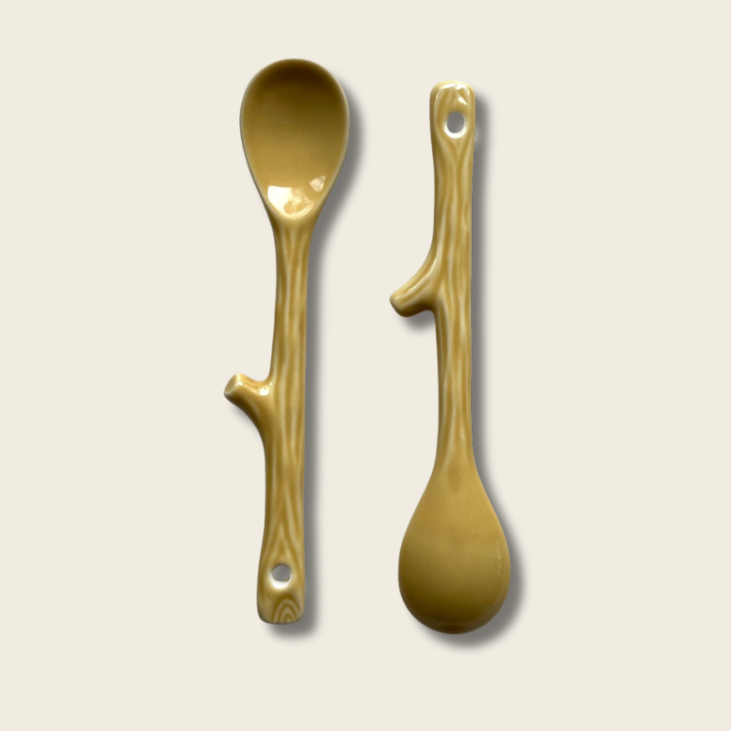 a front and back view of a ceramic spoon