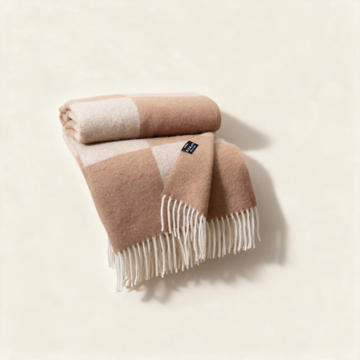 Beige checkerboard wool blanket, folded