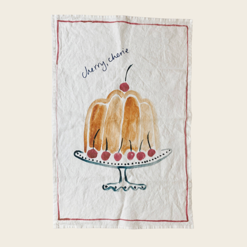 linen tea towel with cake on a stand and the text cherry, cherie 