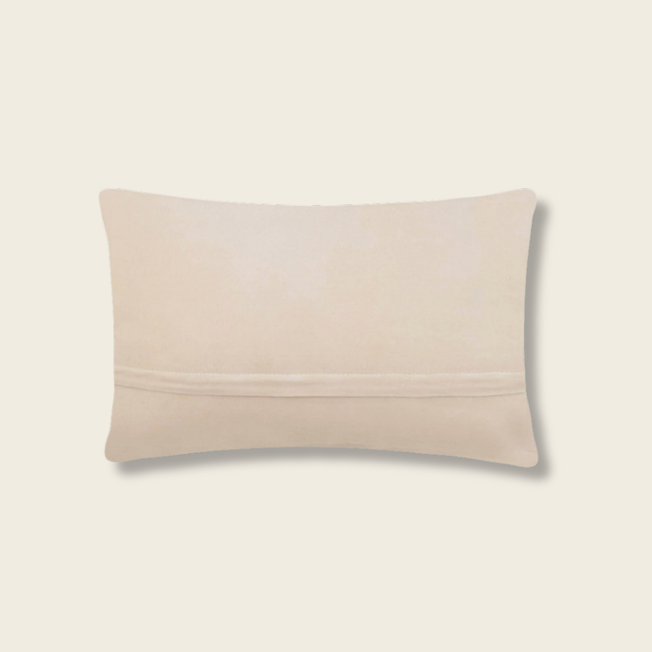 Beige pillow on a beige background
