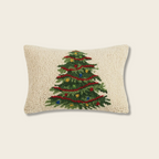 Decorative pillow with a Christmas tree design on a beige background