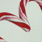 Close-up of red and white striped card on a textured background
