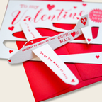 Valentine's Day card with white wings and red envelope