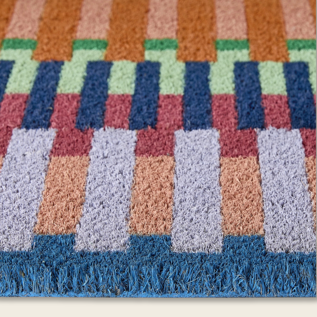 Striped coir door mat, close-up detail