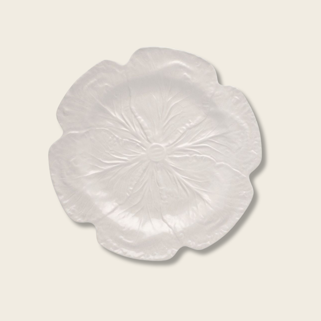 cream cabbage leaf ceramic plate on a beige background