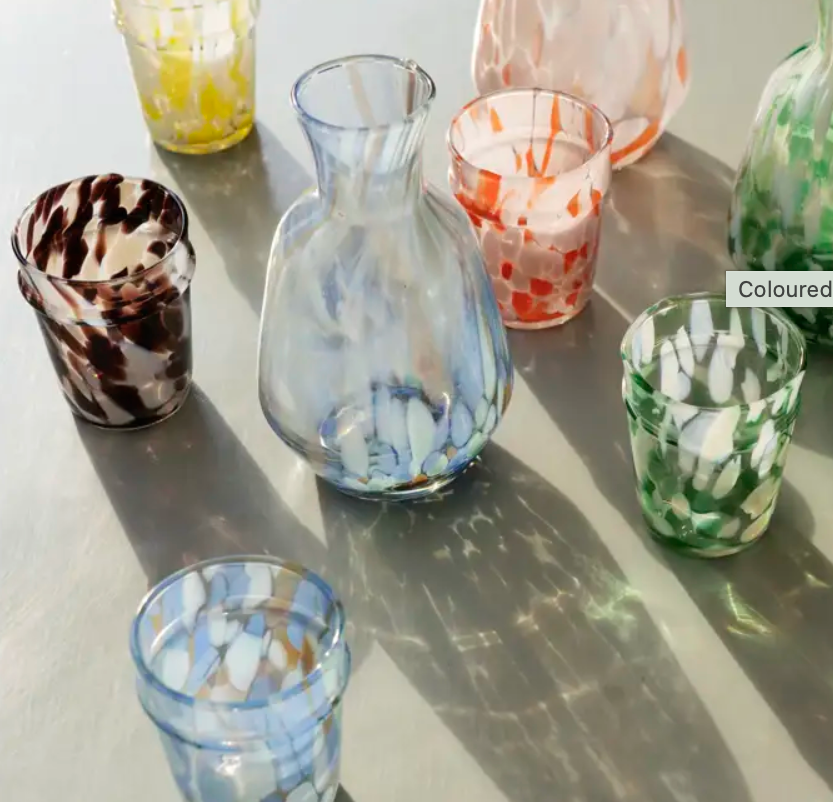 group of coloured speckled drinking glass and jug