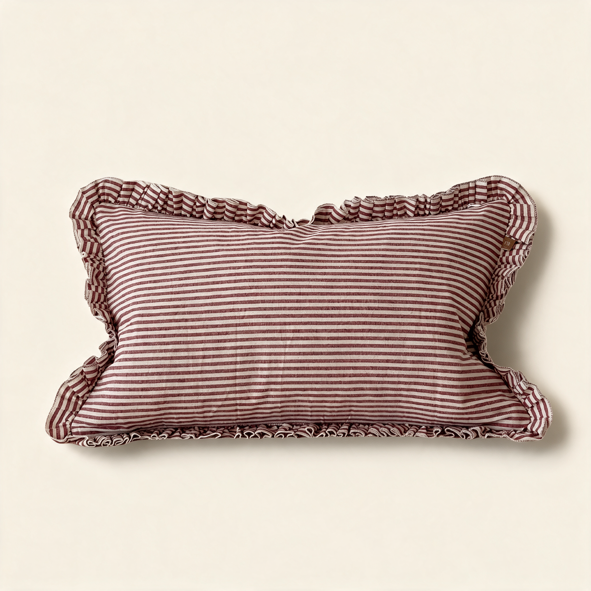 Darcy ruffle cushion cover in burgundy stripe with a frilled edge, 50 by 30 cm