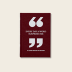 Maroon notebook with white text and quotation marks on a beige background