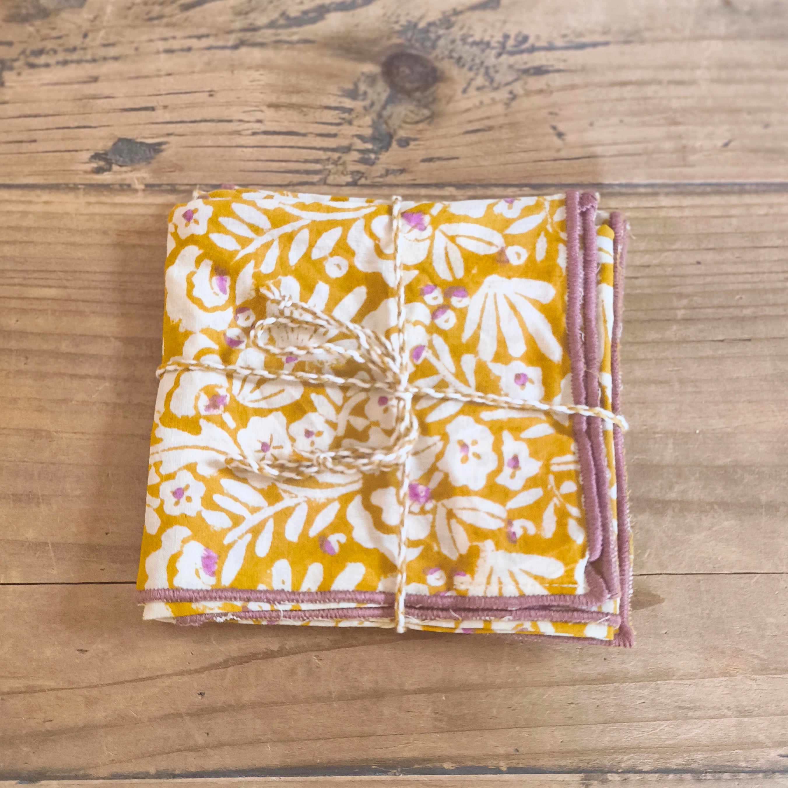 Packaged product with floral design on a wooden surface