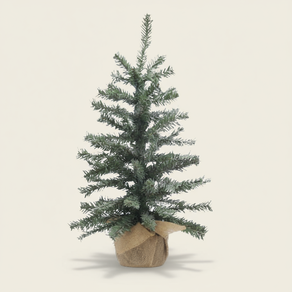 Small artificial Christmas tree in a decorative bag on a beige background