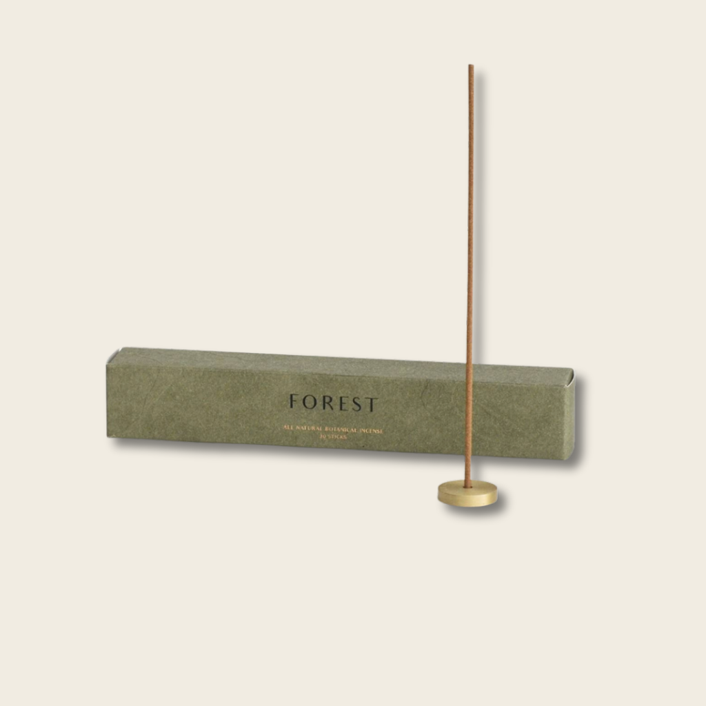 Incense stick with a 'FOREST' branded box on a beige background