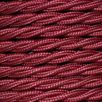 Close-up of braided purple cord on a beige background