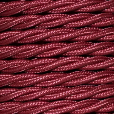Close-up of braided purple cord on a beige background