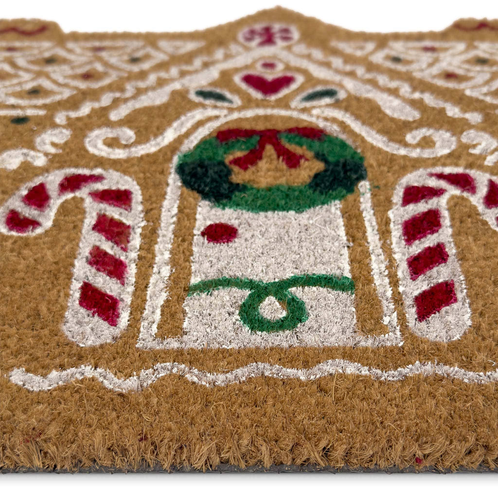 Gingerbread cottage coir doormat shown in a doorway setting