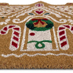 Gingerbread cottage coir doormat shown in a doorway setting