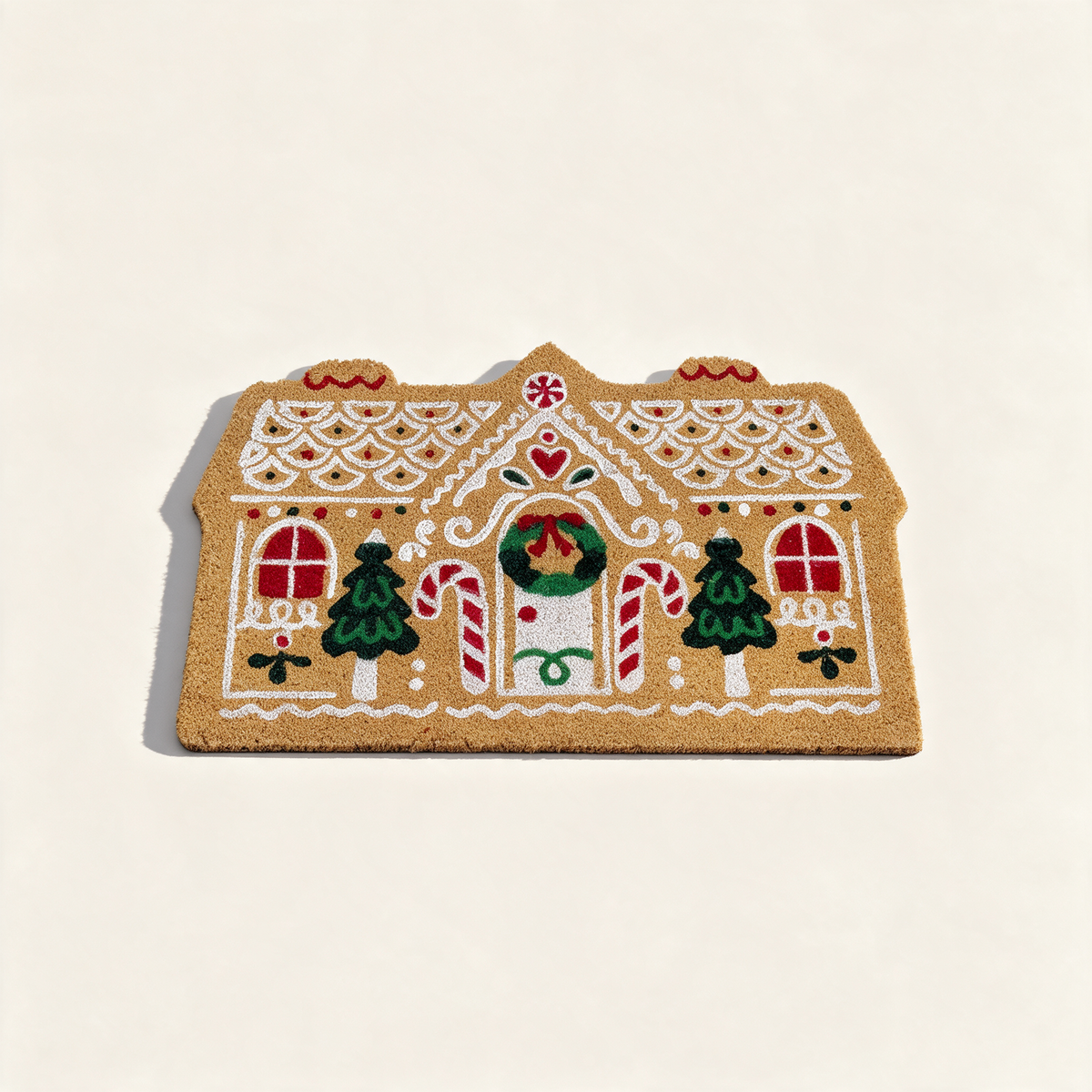 Gingerbread cottage shaped coir doormat with festive treats