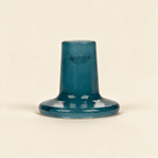 Mineral blue recycled bubble glass candleholder on a cream background