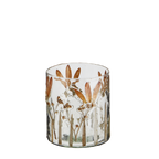 Small glass votive with flower petals set into the glass