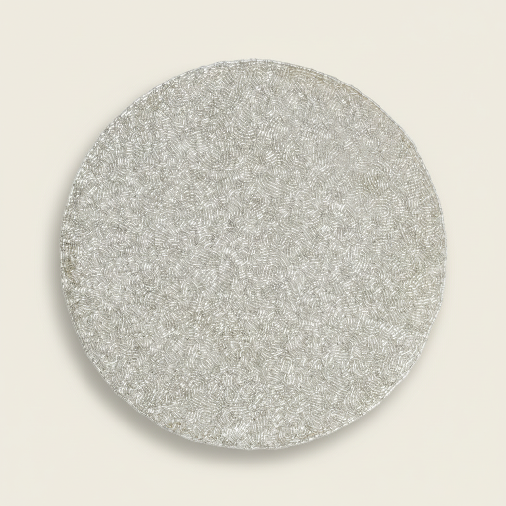 Round metallic object on a white background