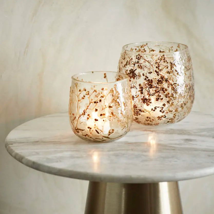 two glass vases used as candleholders with inlaid leaves