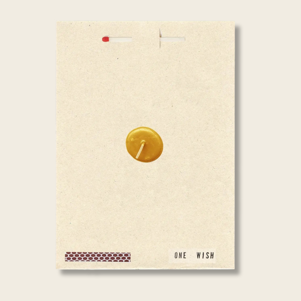 Beige card with a gold coin and 'One Wish' text on a light gray background