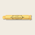 Roll of wish paper with a decorative label on a beige background