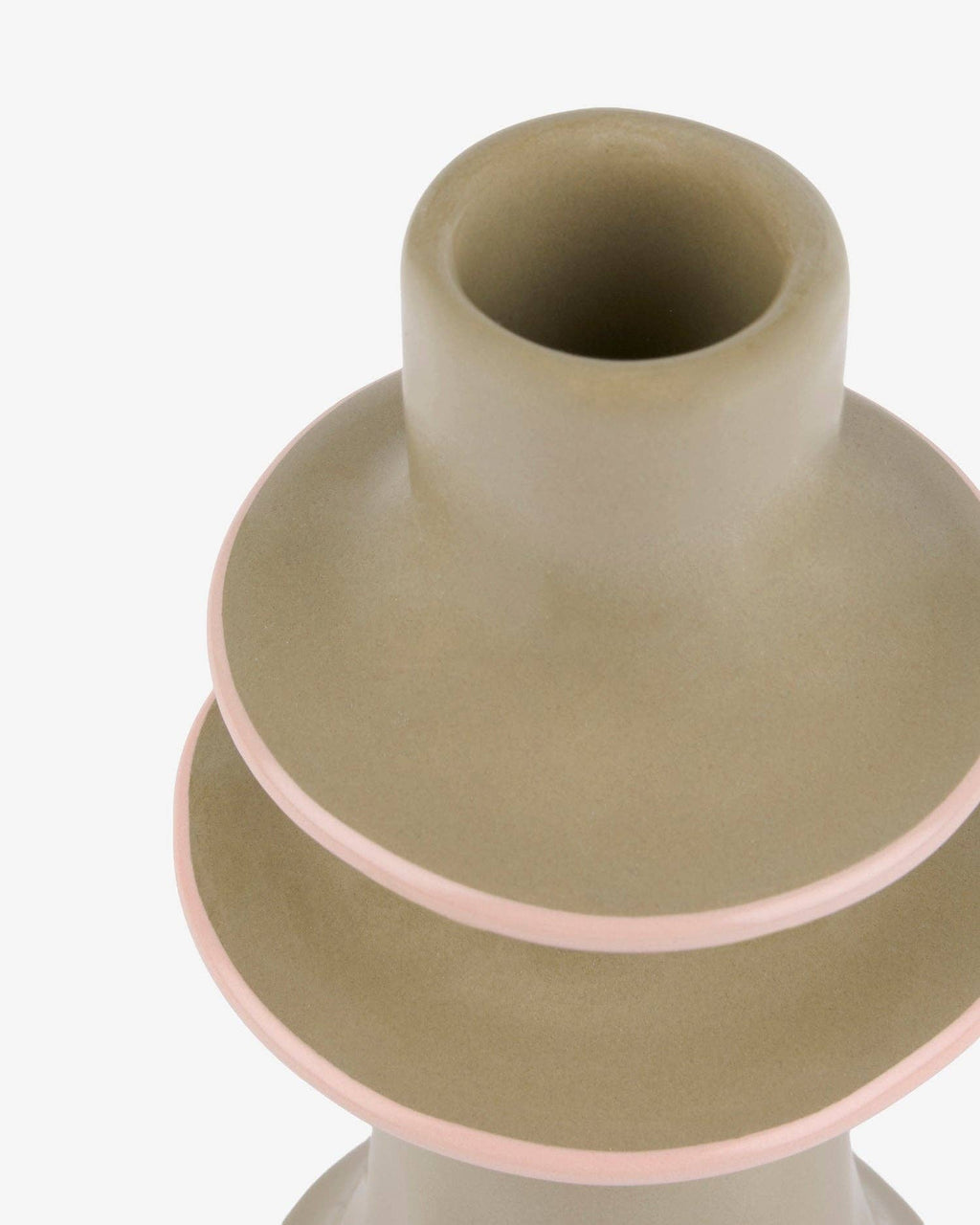 Green stoneware candlestick holding a dinner candle