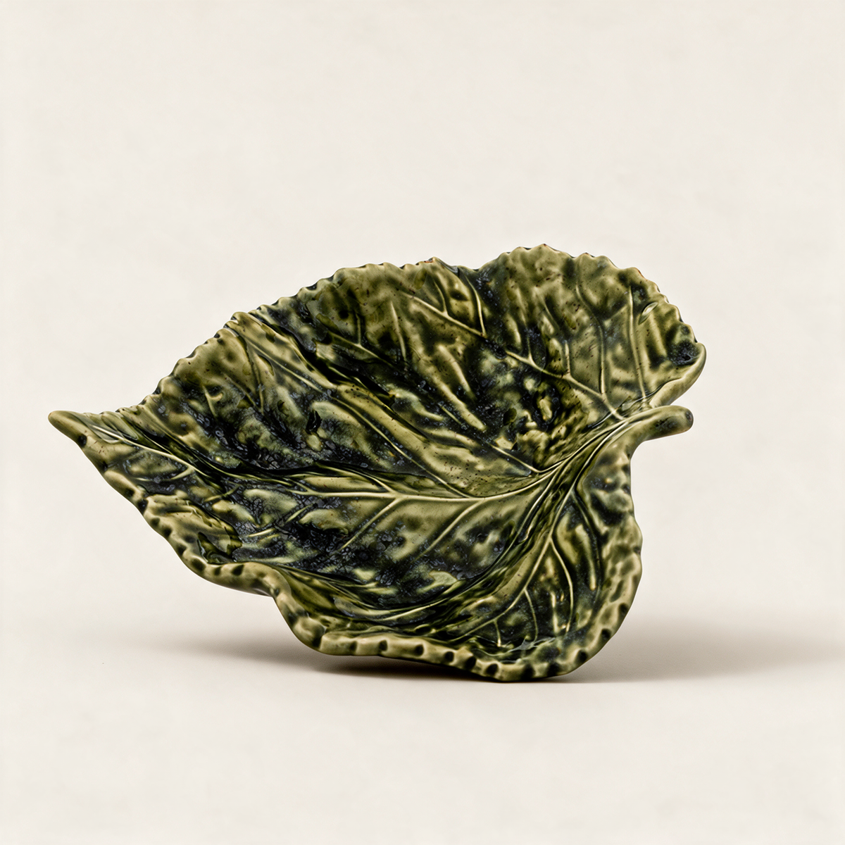 Small green hand-painted earthenware birch leaf serving dish from the Gudrun collection