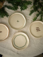 Cream stoneware pine snack plate styled for festive baking