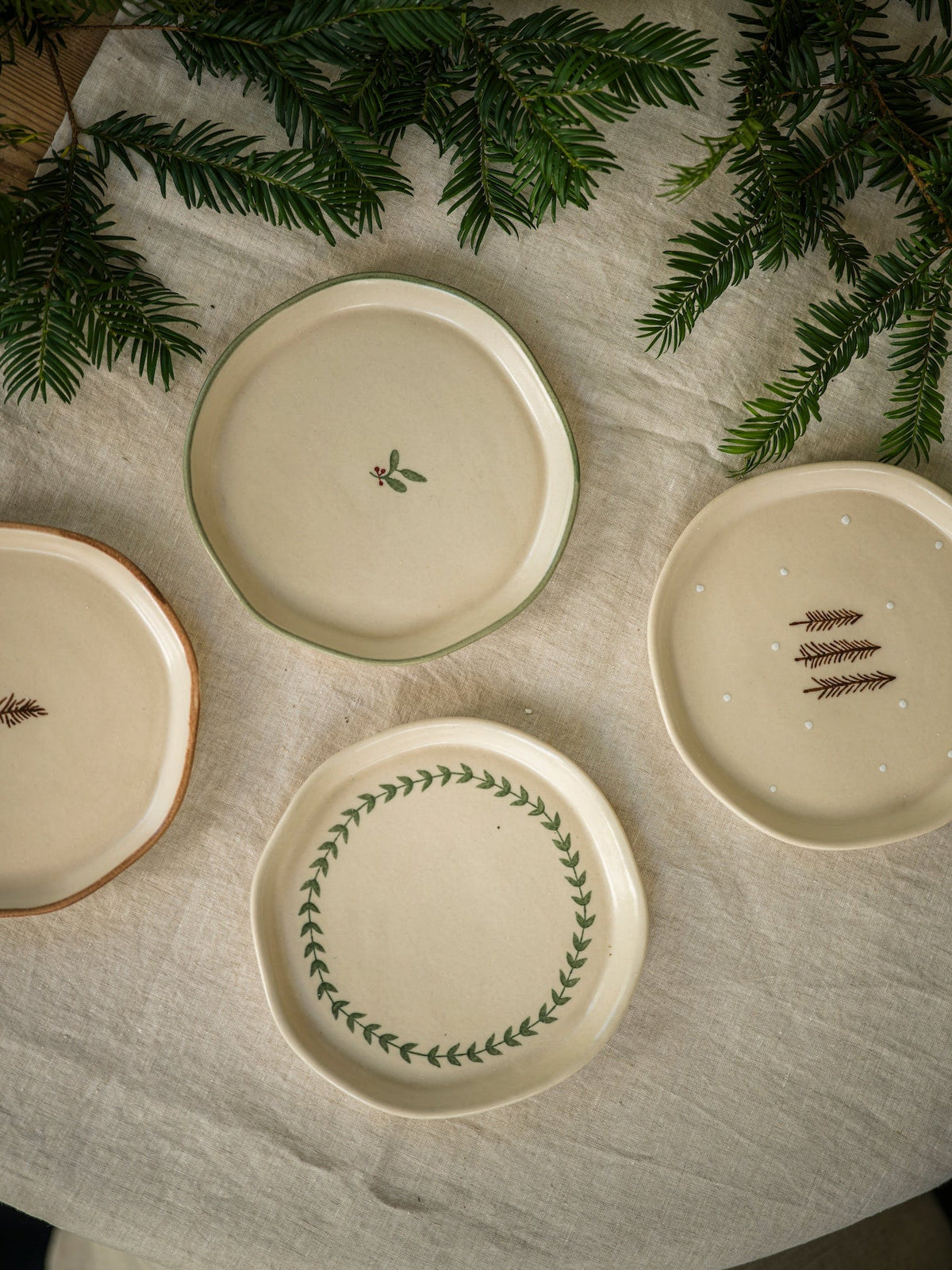 Cream stoneware pine snack plate styled for festive baking