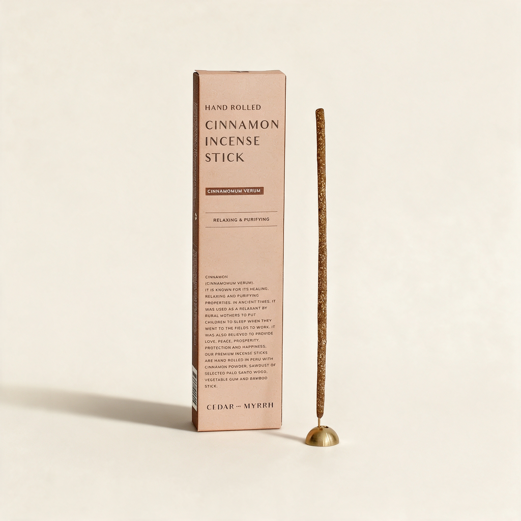 Bundle of hand-rolled cinnamon incense sticks by Cedar and Myrrh on a warm cream background