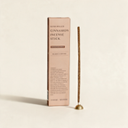 Bundle of hand-rolled cinnamon incense sticks by Cedar and Myrrh on a warm cream background