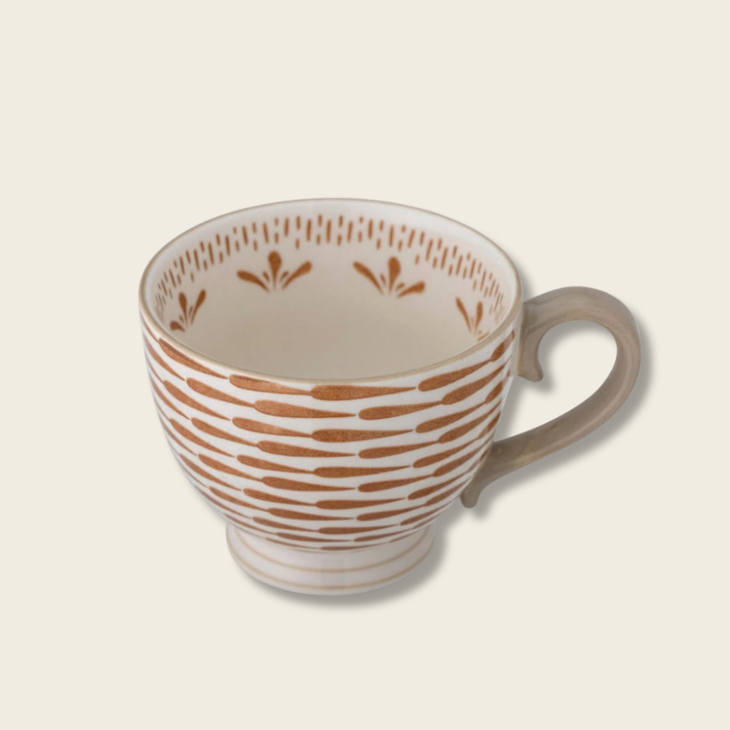 Ceramic mug with brown pattern on a white background