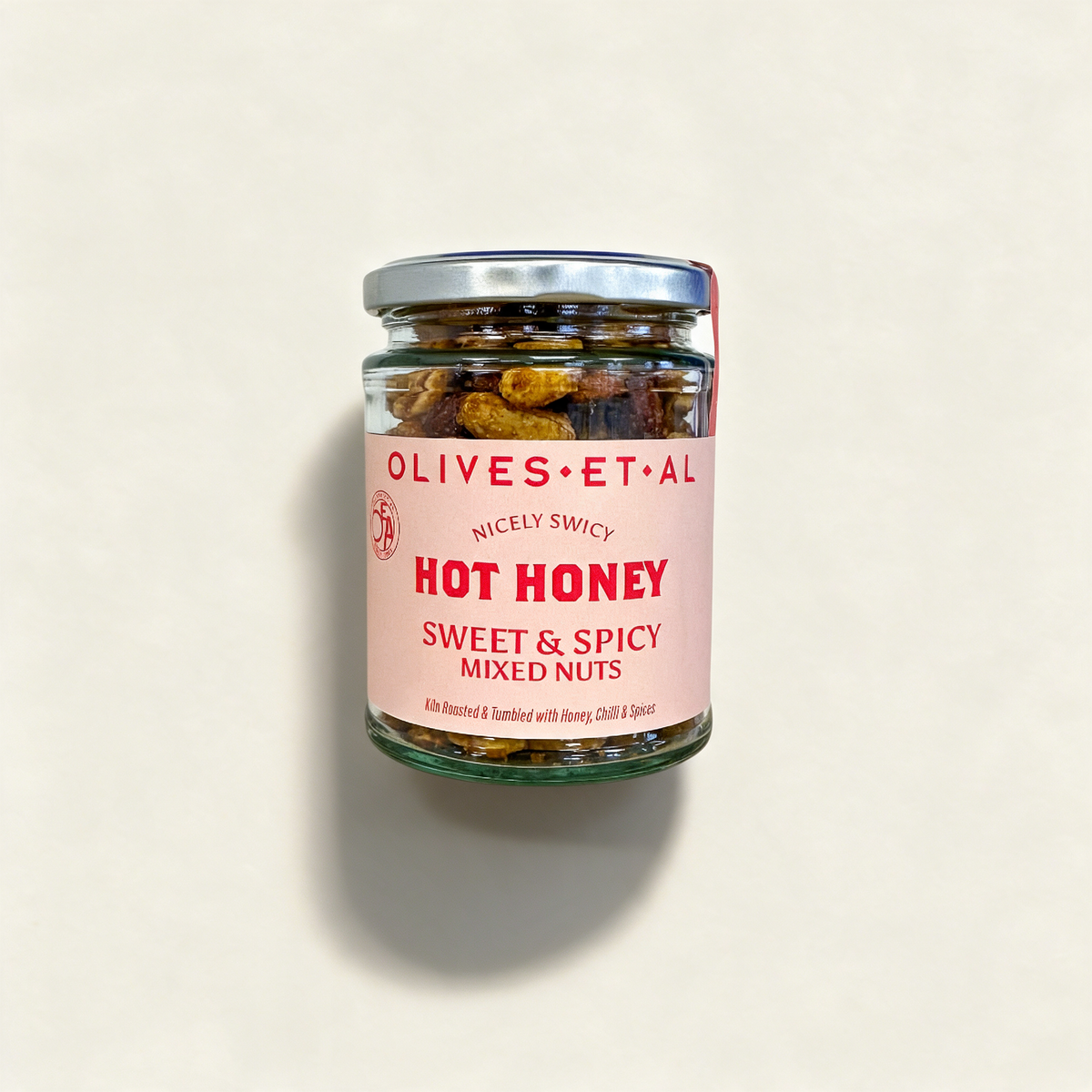 Hot Honey Mixed Kiln Roasted Nuts on a cream background