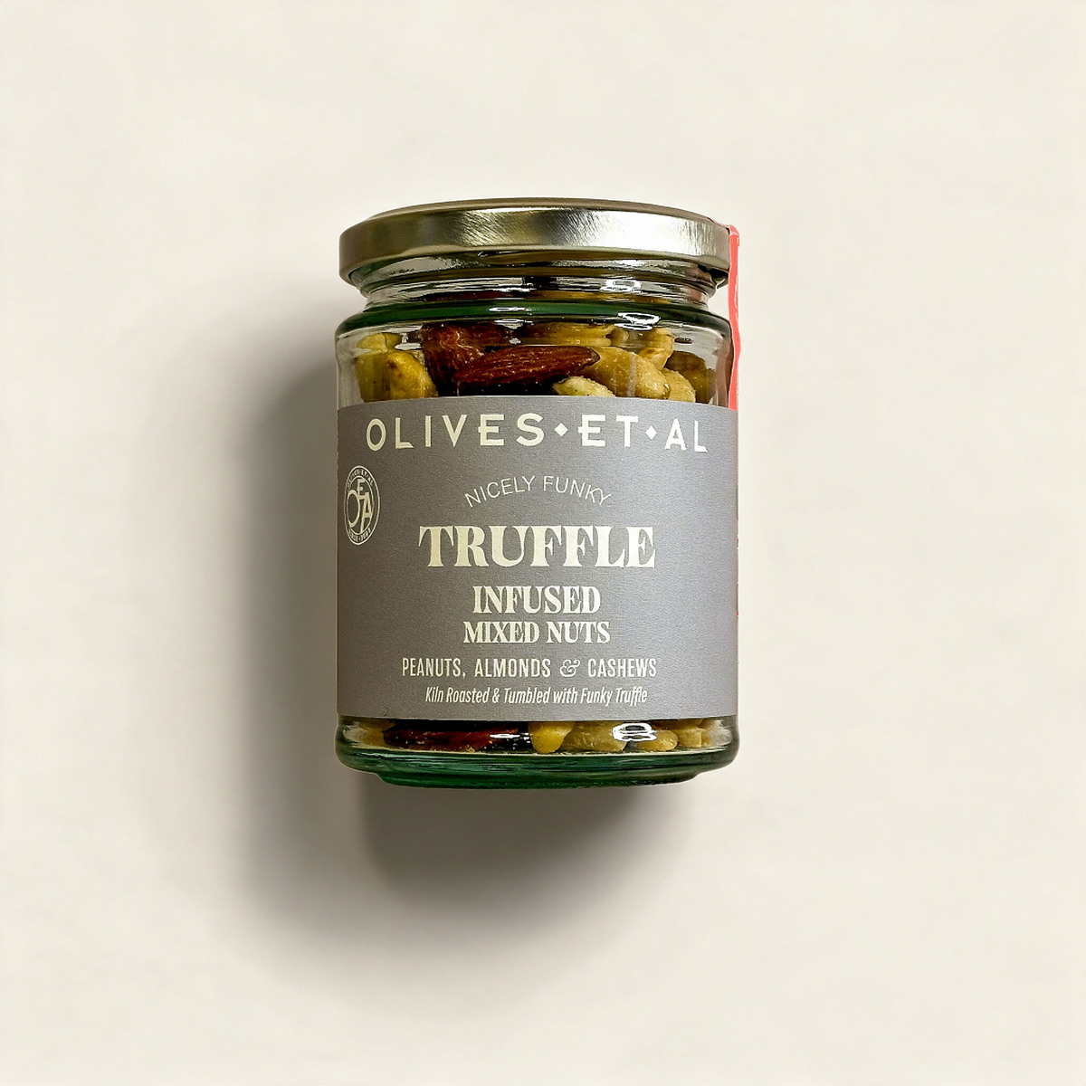 Truffle Salted Roasted Nuts on a cream background