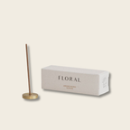 Incense stick with a box labeled 'Floral' on a beige background