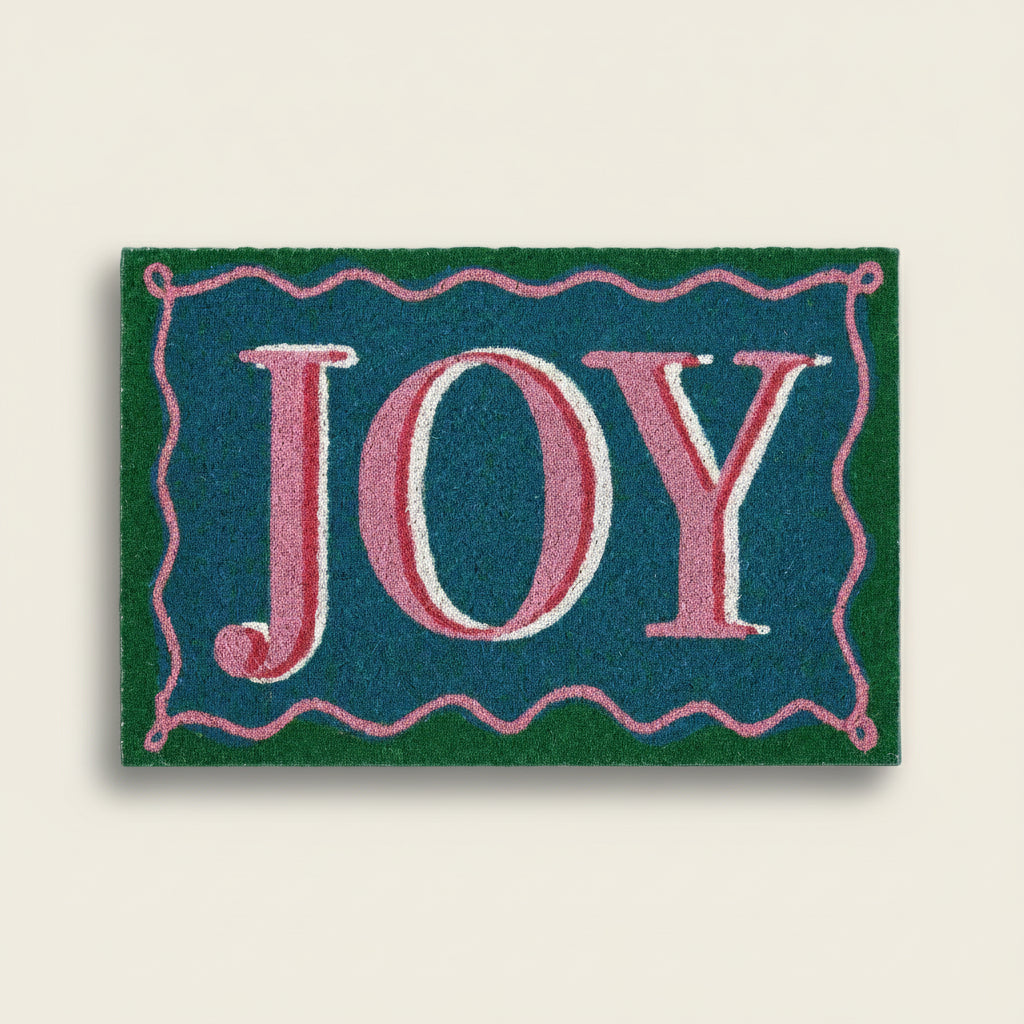 Doormat with 'JOY' text on a blue background