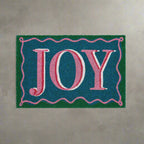 Doormat with 'JOY' text on a blue background