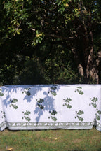 Khaki oak leaf cotton tablecloth laid across a table