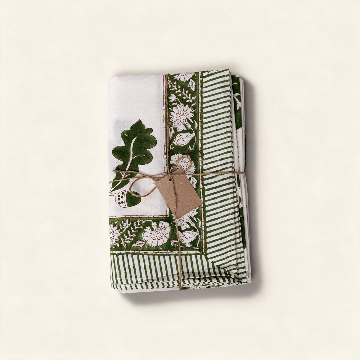 Khaki cotton tablecloth with an oak leaf block print and bordered edge