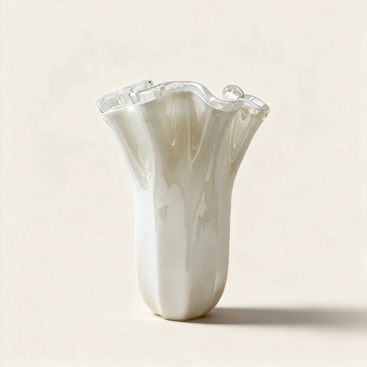Large ivory Murano glass handkerchief vase with a softly folded rim on a cream background