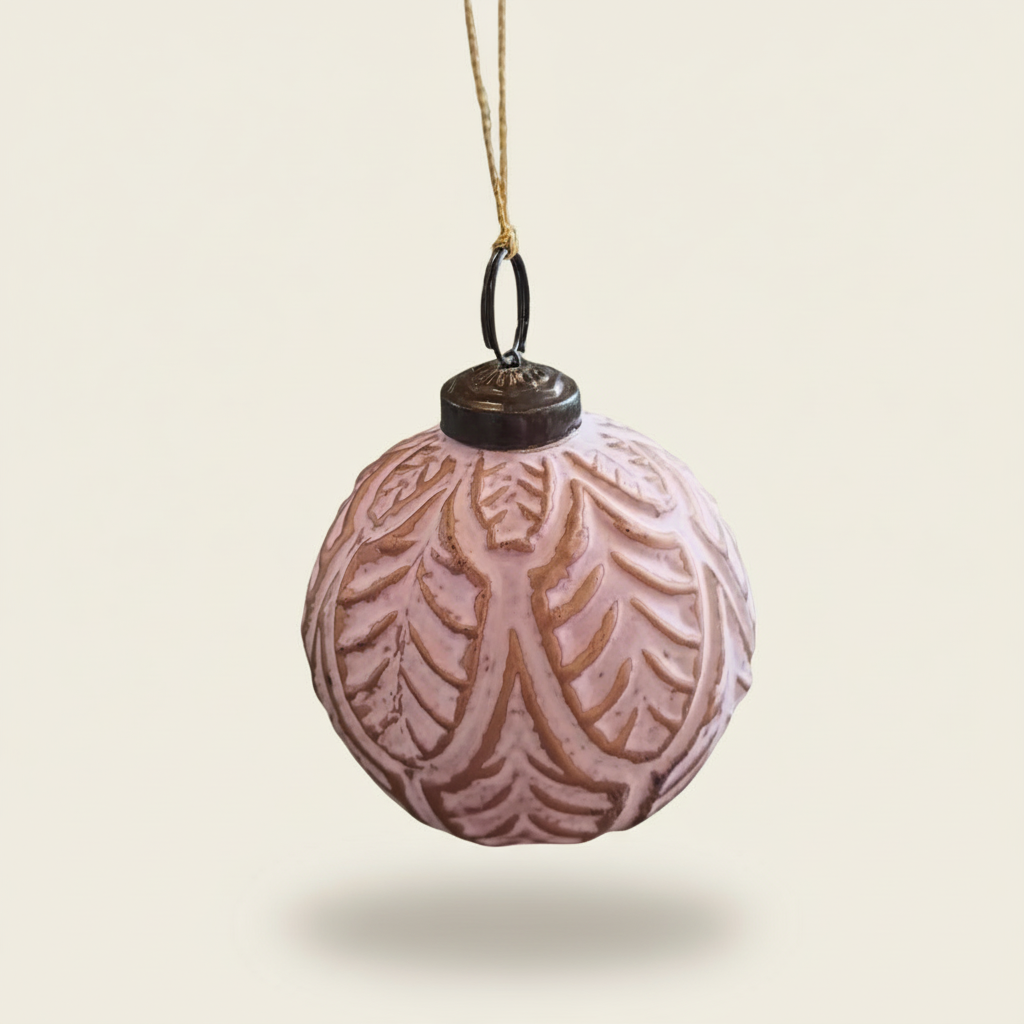 Decorative pink ornament with leaf pattern on a beige background