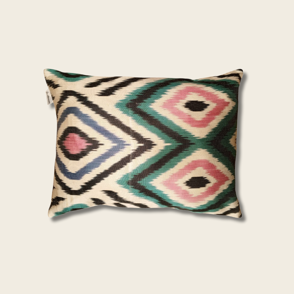 Decorative pillow with geometric pattern on a beige background